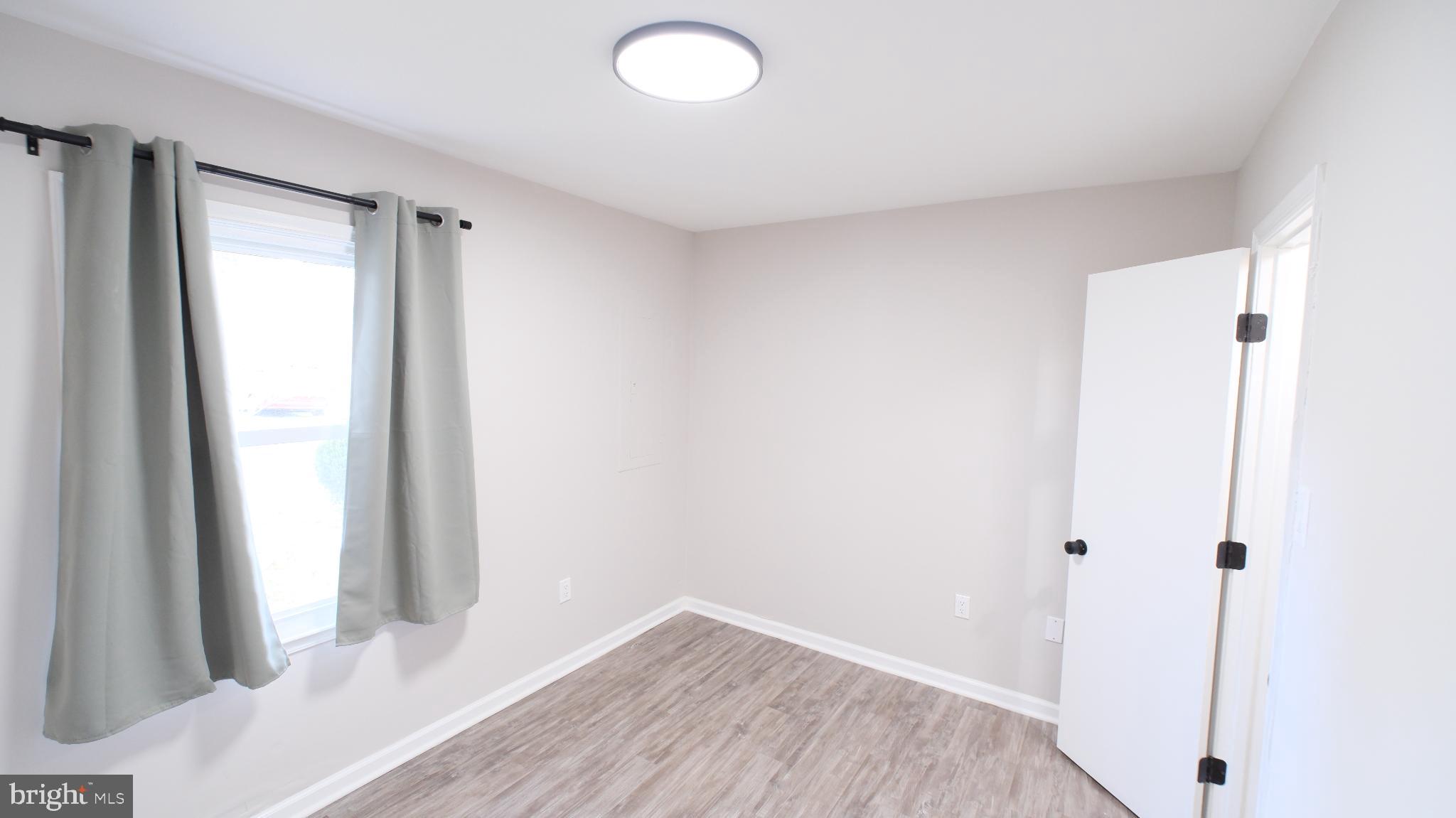 124 East Park Avenue Ranson, WV 25438 - Photo 14 of 23 a view of bathroom with wooden floor