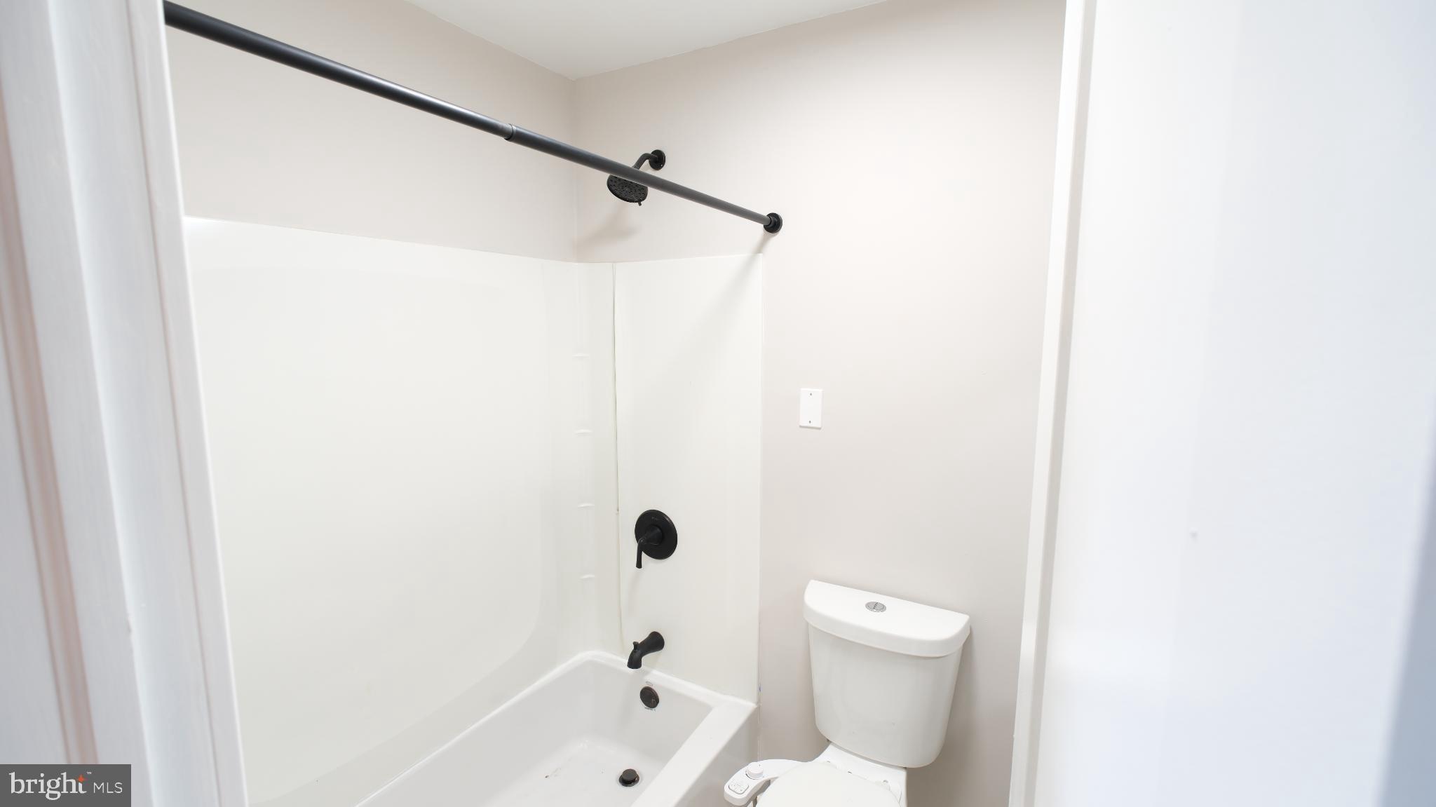 124 East Park Avenue Ranson, WV 25438 - Photo 18 of 23 a bathroom with a bathtub and a toilet