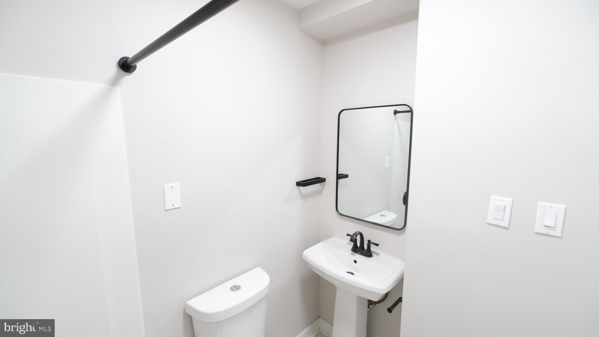 124 East Park Avenue Ranson, WV 25438 - Photo 19 of 23 a bathroom with a sink toilet and mirror