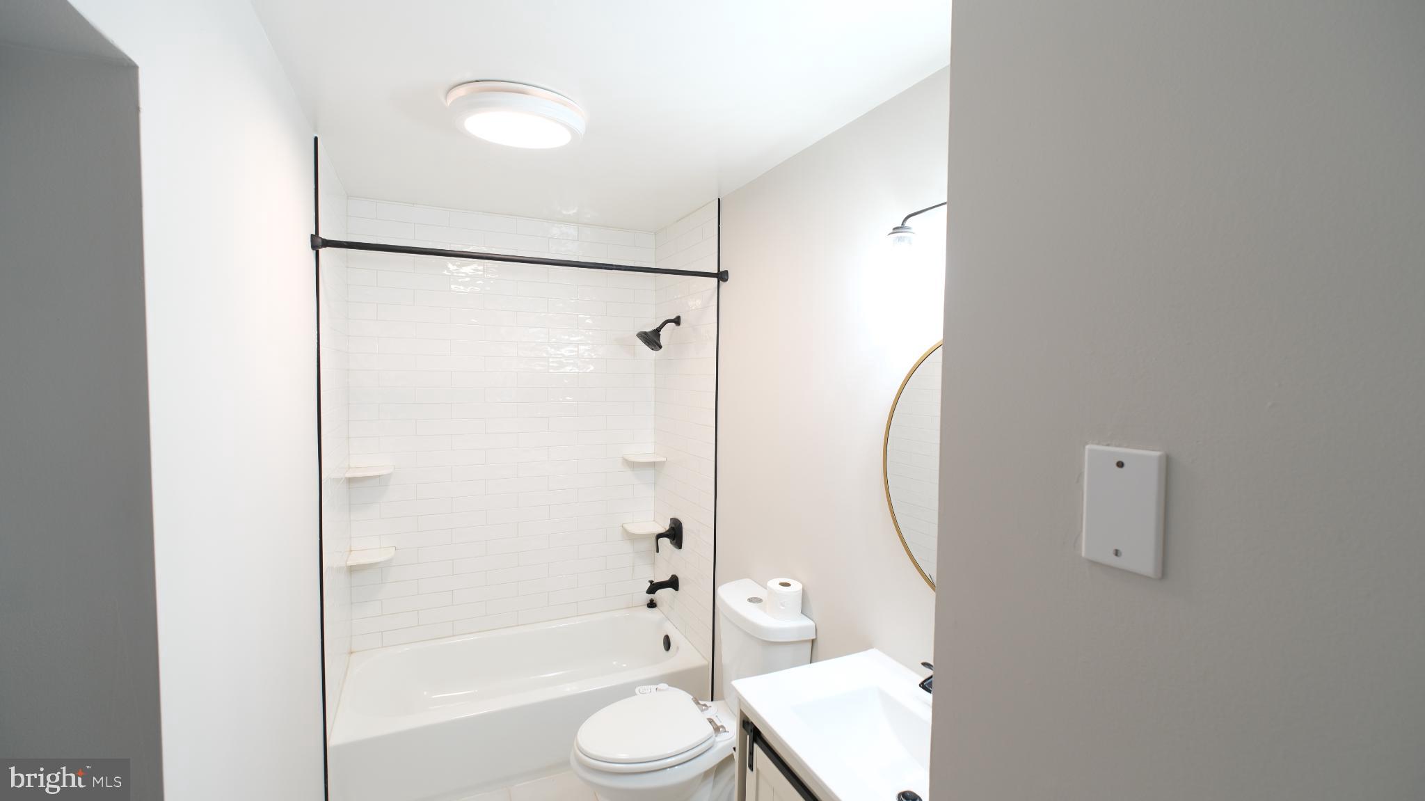 124 East Park Avenue Ranson, WV 25438 - Photo 20 of 23 a bathroom with a toilet and a shower