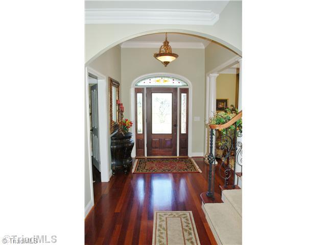 5624 Cape Fox Drive Oak Ridge, NC 27310 - Photo 2 of 16 Entry. Beveled leaded glass front door with side lites & transom creates an elegant entry.