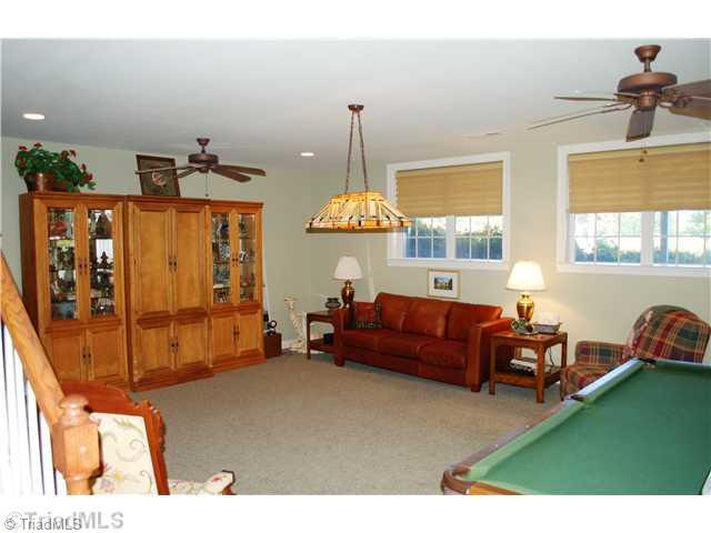 5624 Cape Fox Drive Oak Ridge, NC 27310 - Photo 12 of 16 Game. Lower level game/rec room has plenty of room for a pool table.