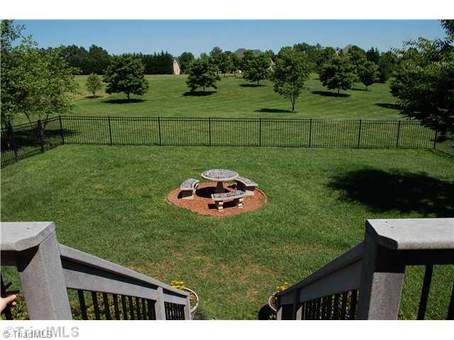 5624 Cape Fox Drive Oak Ridge, NC 27310 - Photo 16 of 16 Yard/Garden. View of backyard from deck.