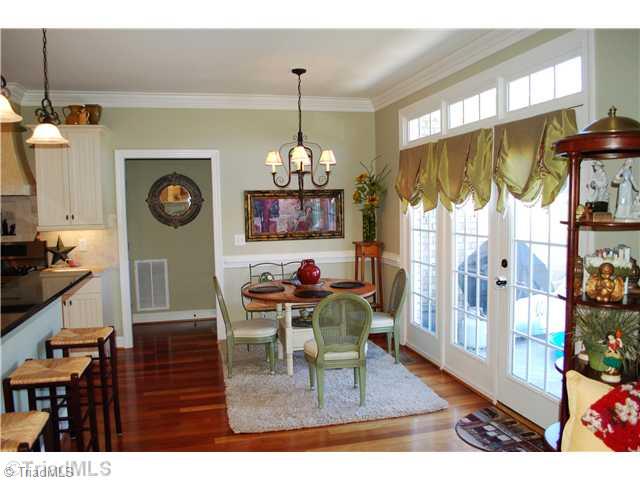 5624 Cape Fox Drive Oak Ridge, NC 27310 - Photo 6 of 16 Breakfast. This bright breakfast area opens up to an expansive deck via French doors.