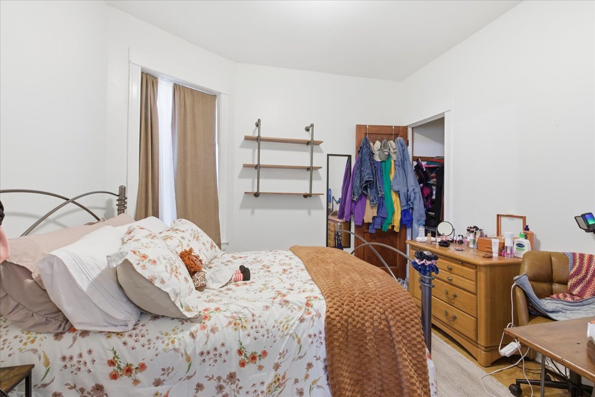 2333 North Hamlin Avenue, Unit 1 Chicago, IL 60647 - Photo 6 of 13 a bedroom with a bed and a closet