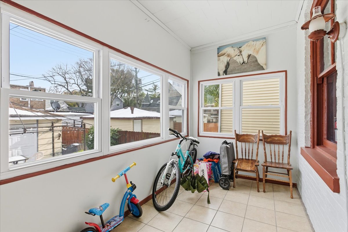 2333 North Hamlin Avenue, Unit 1 Chicago, IL 60647 - Photo 10 of 13 a view of an empty room with windows
