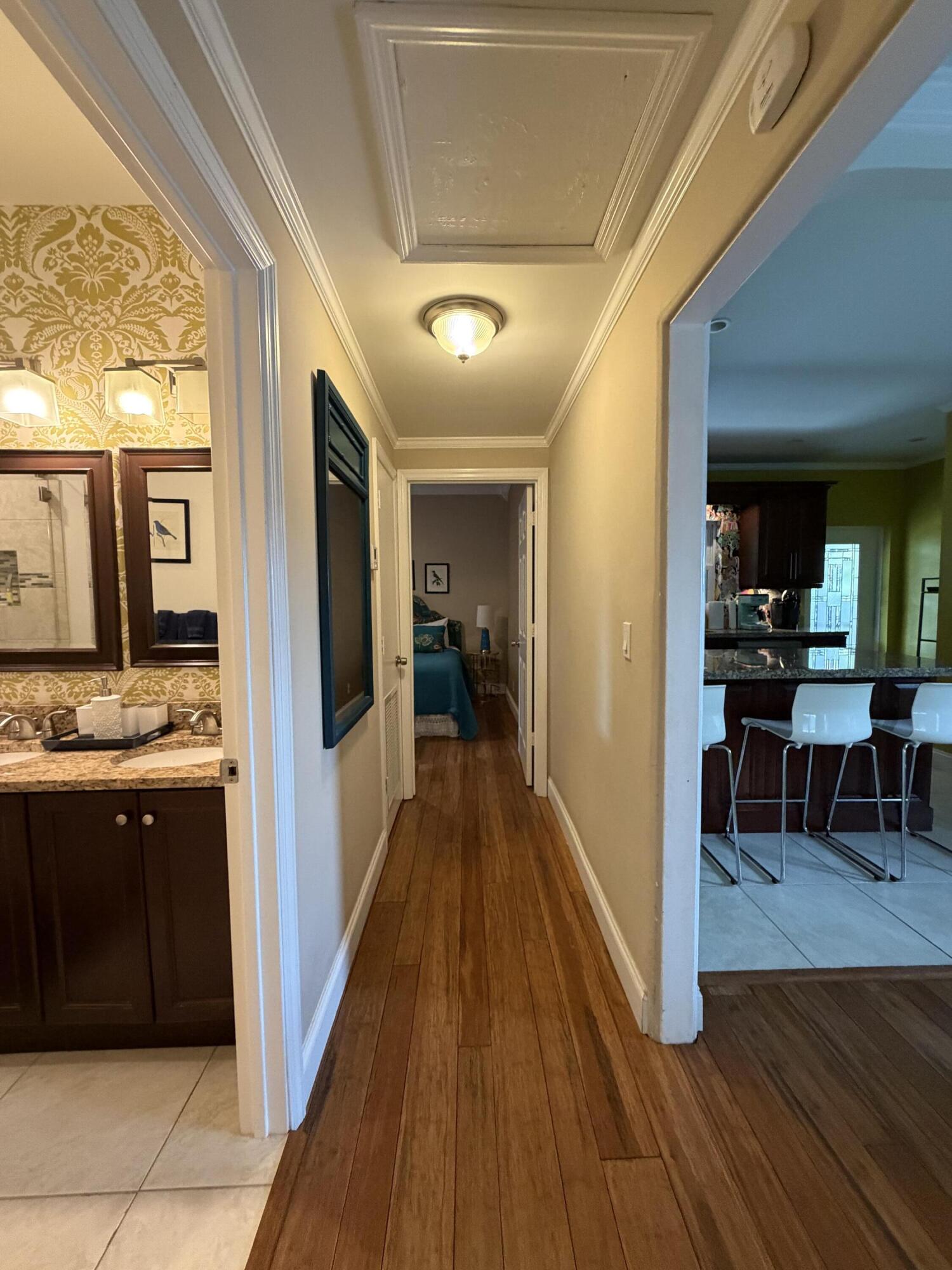 515 Ardmore Road West Palm Beach, FL 33401 - Photo 12 of 36 a view of a hallway view with living room and dining room