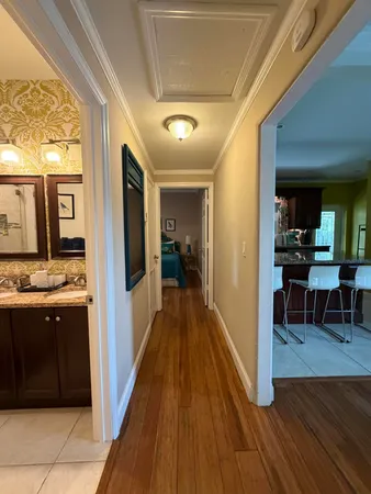 a view of a hallway view with living room and dining room