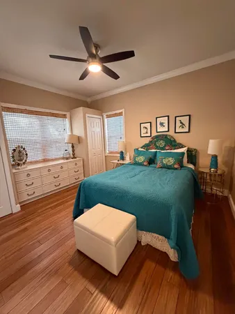 a bedroom with a bed and a night stand