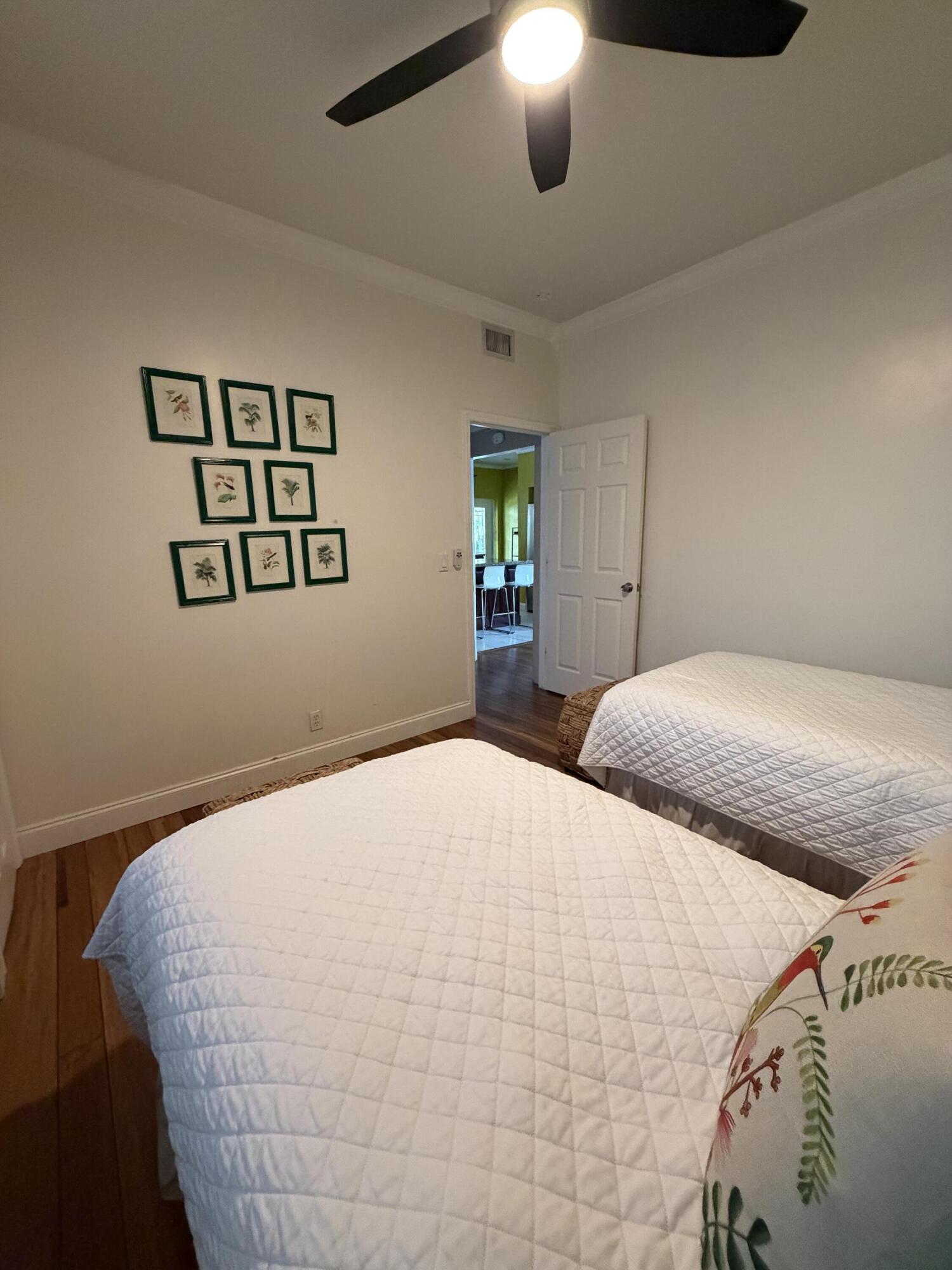 515 Ardmore Road West Palm Beach, FL 33401 - Photo 17 of 36 a bedroom with a bed and a painting on the wall