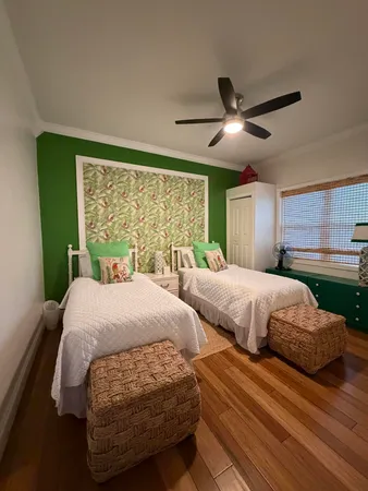 a bedroom with double bed and a large window