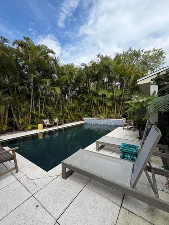 a view of swimming pool with a patio