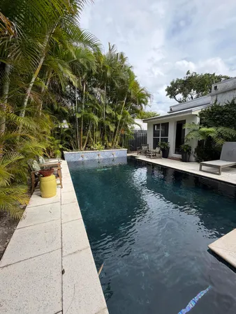 a view of swimming pool with lounge chair