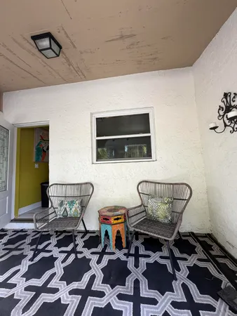 a living room with furniture and a rug