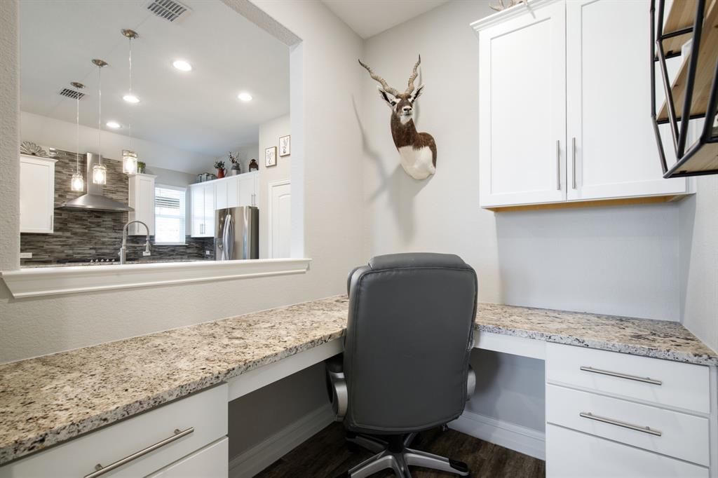 4113 Crossroads Court Oak Point, TX 75068 - Photo 11 of 33 a kitchen with granite countertop white cabinets and white appliances