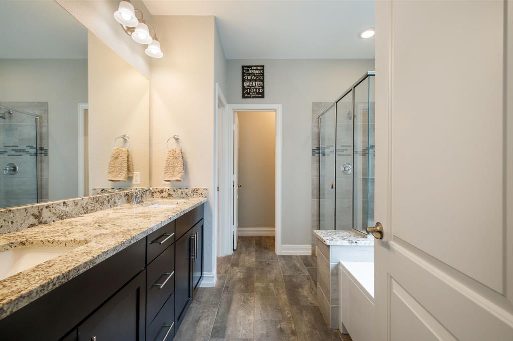 4113 Crossroads Court Oak Point, TX 75068 - Photo 14 of 33 a bathroom with a granite countertop sink and a mirror
