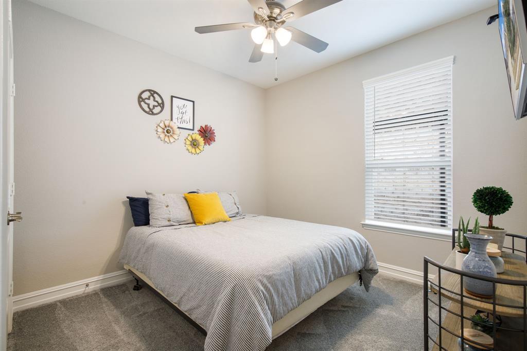 4113 Crossroads Court Oak Point, TX 75068 - Photo 18 of 33 a bedroom with bed and window