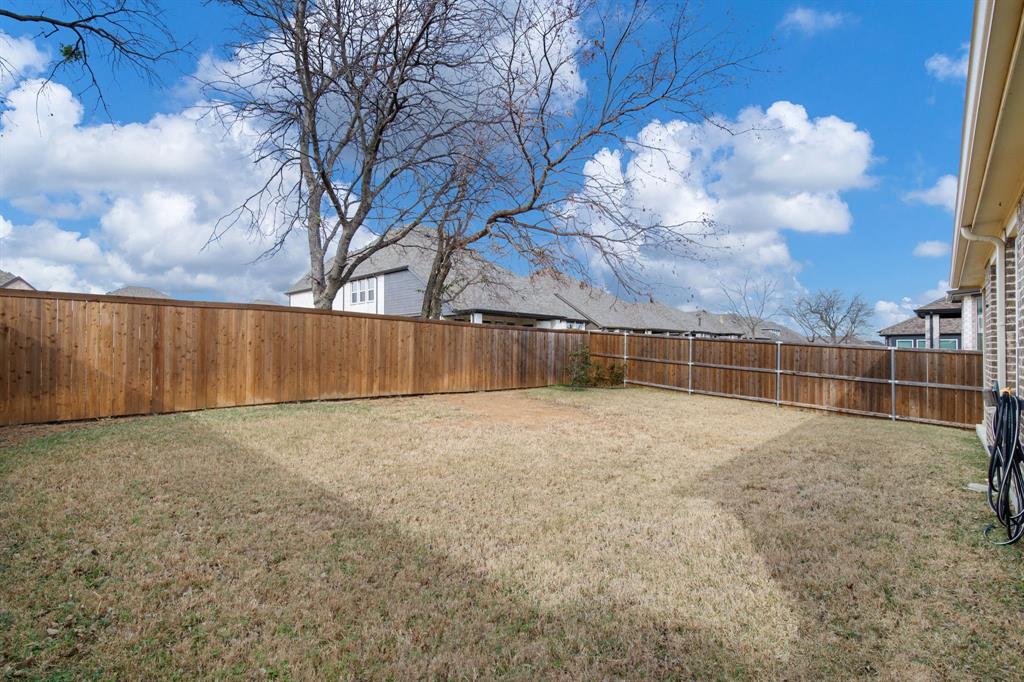4113 Crossroads Court Oak Point, TX 75068 - Photo 25 of 33 a view of an outdoor space and wooden fence