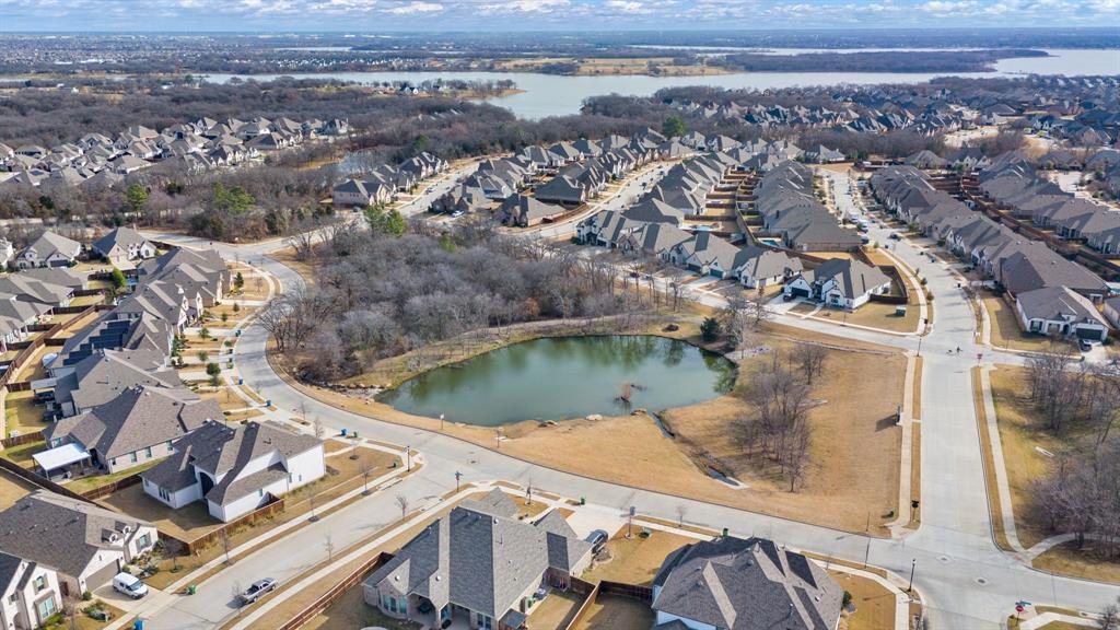 4113 Crossroads Court Oak Point, TX 75068 - Photo 29 of 33 an aerial view of a house with a lake view