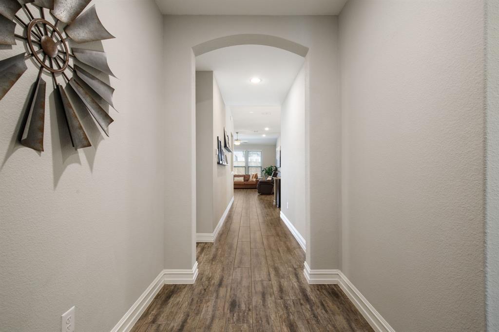 4113 Crossroads Court Oak Point, TX 75068 - Photo 4 of 33 a view of hallway with wooden floor