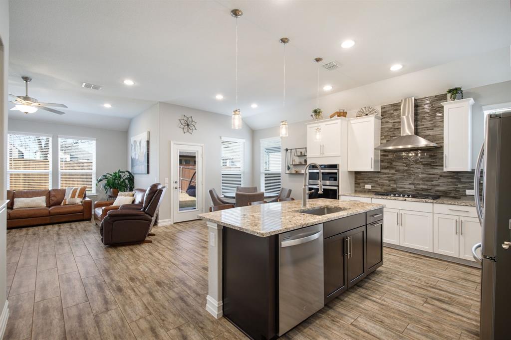 4113 Crossroads Court Oak Point, TX 75068 - Photo 6 of 33 a large white kitchen with stainless steel appliances lots of counter top space