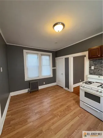 a view of a livingroom with a kitchen