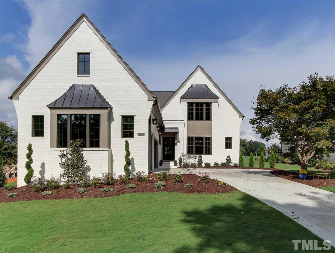 7910 Hardwick Drive Raleigh, NC 27615 - Photo 1 of 25 a front view of house with yard and green space