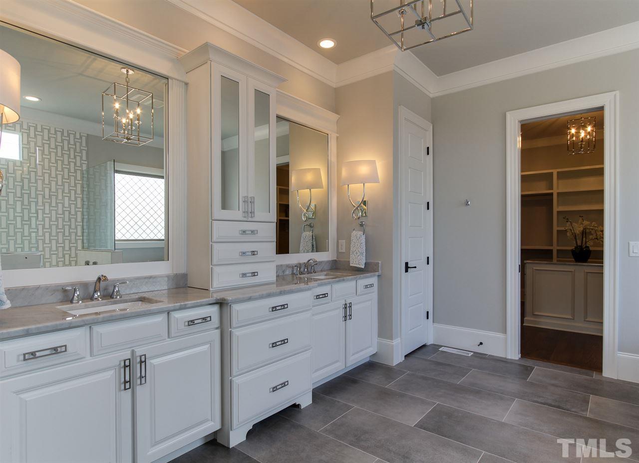 7910 Hardwick Drive Raleigh, NC 27615 - Photo 11 of 25 a bathroom with a granite countertop sink mirror and double