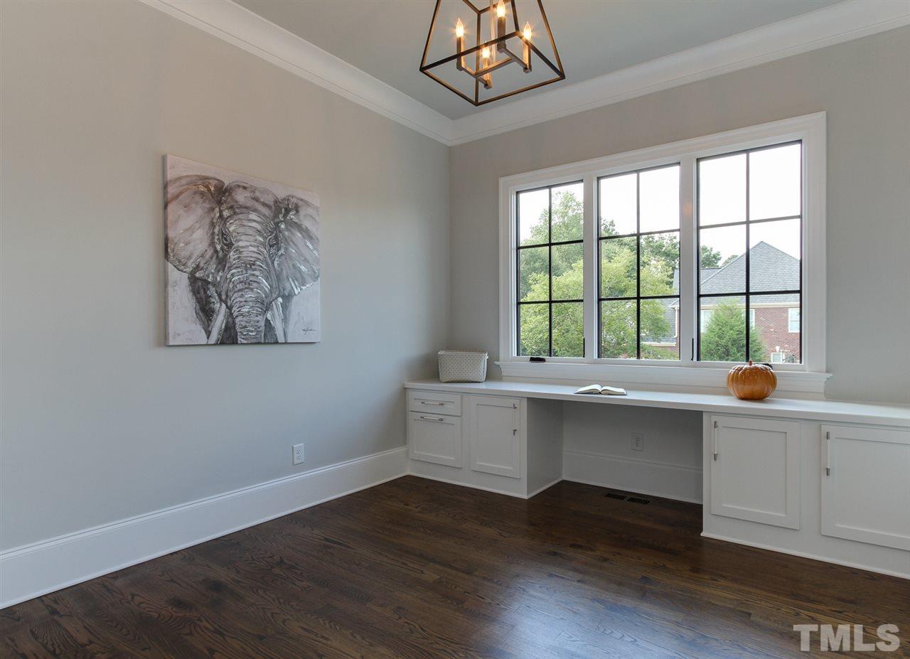 7910 Hardwick Drive Raleigh, NC 27615 - Photo 14 of 25 a room with wooden floor and window