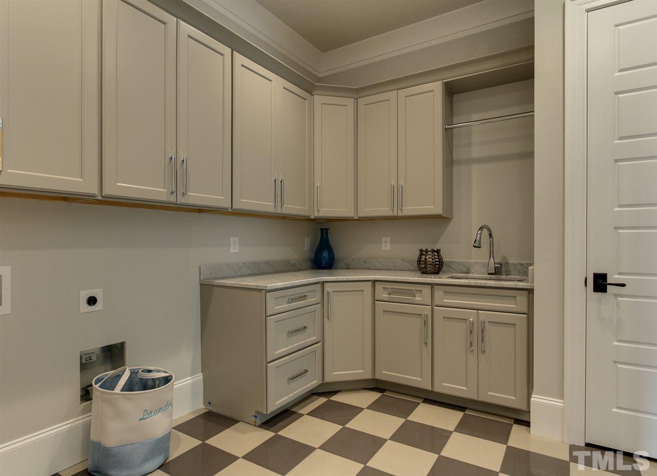 7910 Hardwick Drive Raleigh, NC 27615 - Photo 15 of 25 a kitchen with stainless steel appliances granite countertop a sink and a cabinets