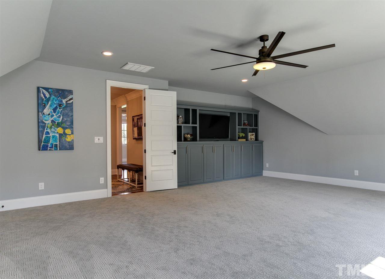 7910 Hardwick Drive Raleigh, NC 27615 - Photo 19 of 25 a view of a livingroom with a ceiling fan and window