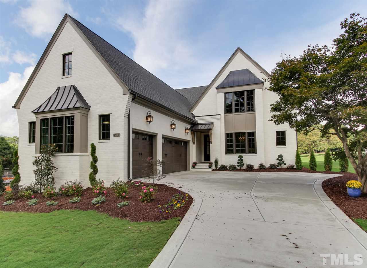 7910 Hardwick Drive Raleigh, NC 27615 - Photo 2 of 25 a front view of a house with a yard