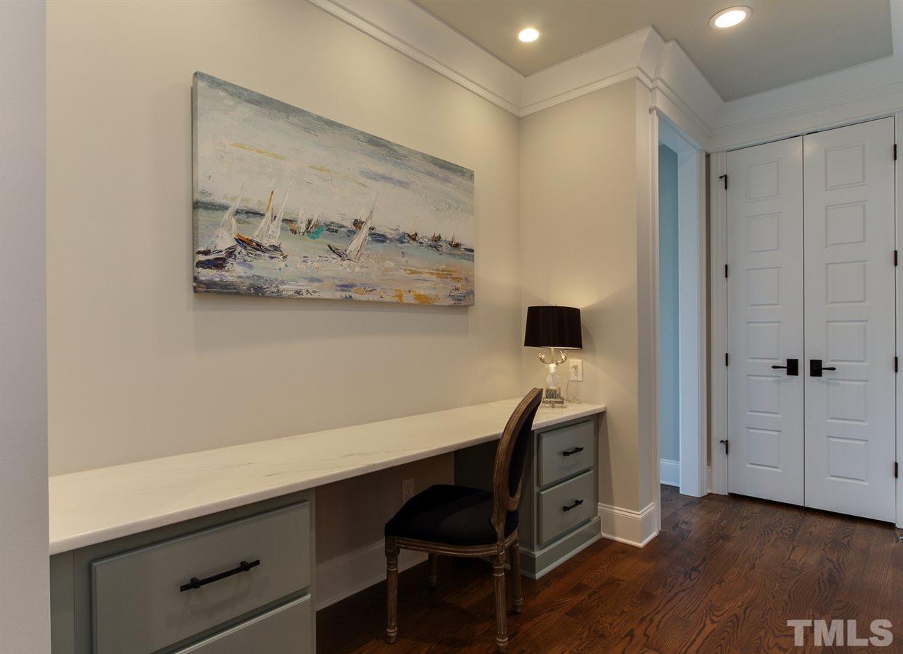 7910 Hardwick Drive Raleigh, NC 27615 - Photo 21 of 25 a view of a workspace with furniture and wooden floor