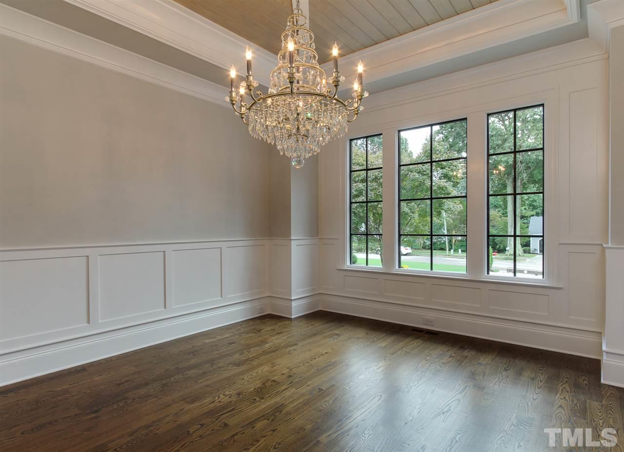 7910 Hardwick Drive Raleigh, NC 27615 - Photo 4 of 25 wooden floor in an empty room with a window