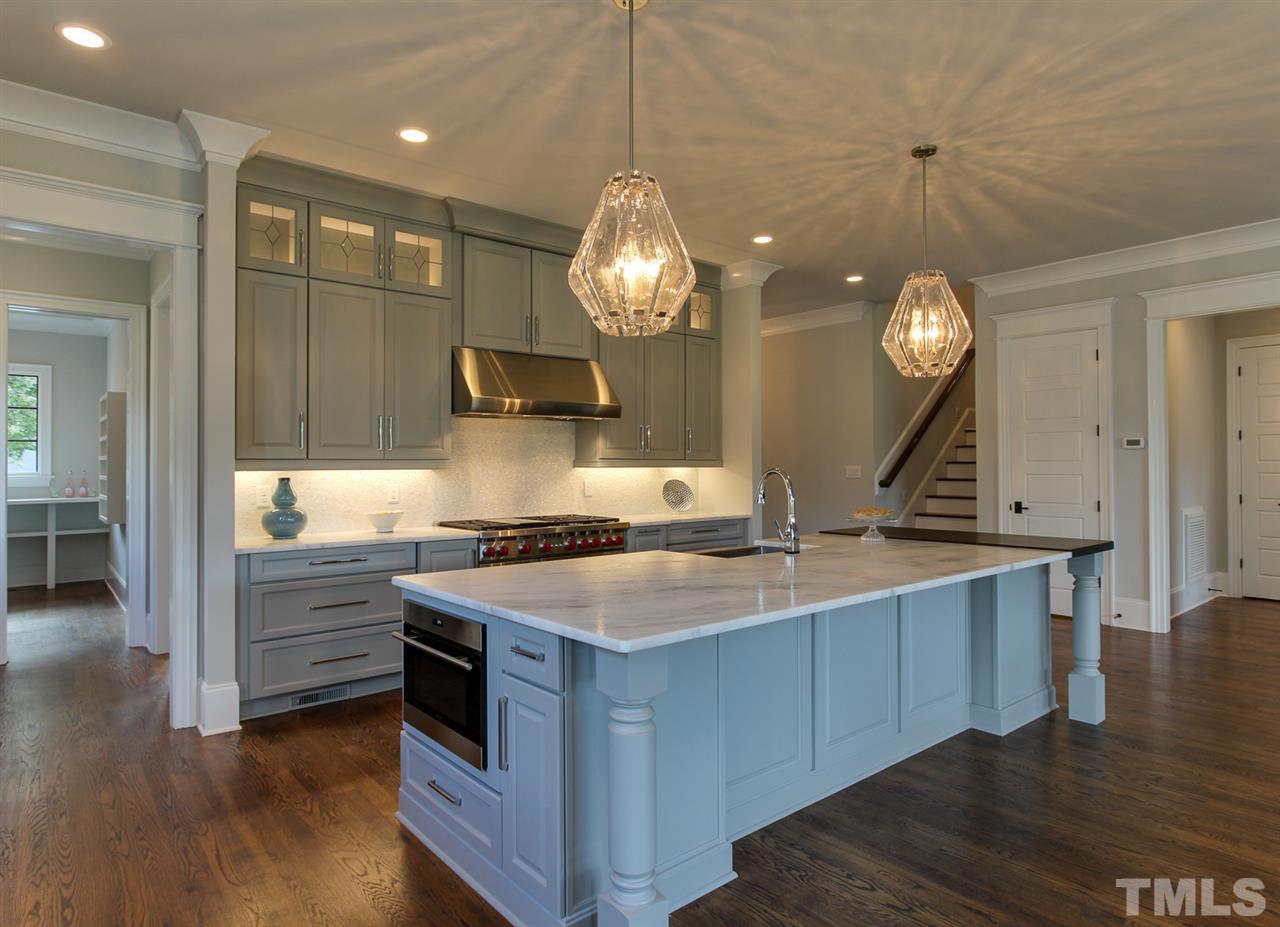 7910 Hardwick Drive Raleigh, NC 27615 - Photo 6 of 25 a kitchen with a sink and chandelier