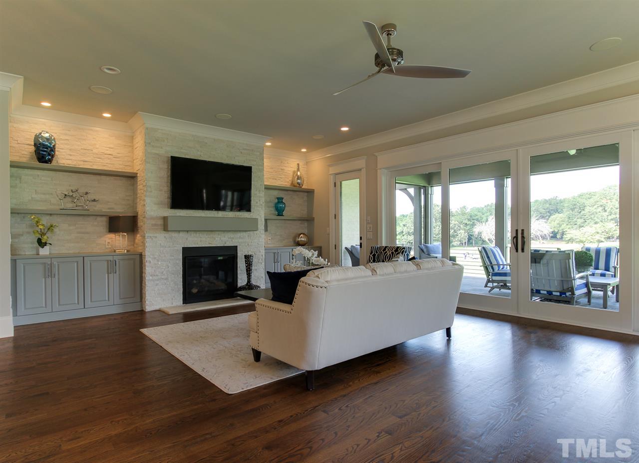 7910 Hardwick Drive Raleigh, NC 27615 - Photo 9 of 25 a living room with fireplace furniture and a flat screen tv