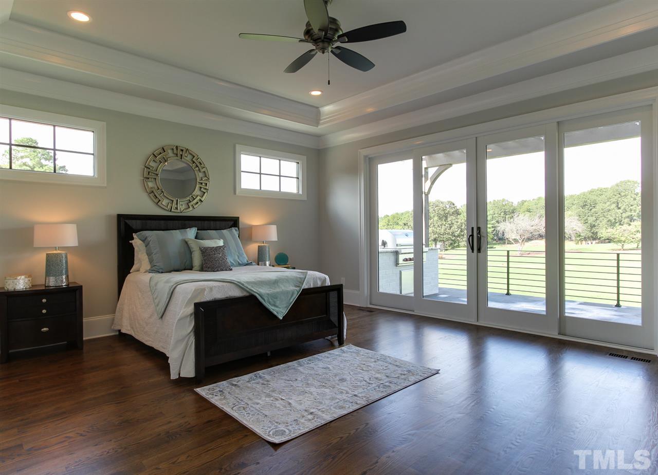 7910 Hardwick Drive Raleigh, NC 27615 - Photo 10 of 25 a bedroom with a large bed and a window