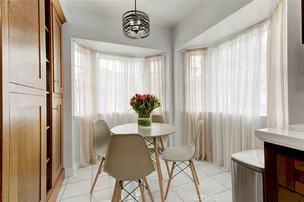 a spacious bathroom with a granite countertop sink and a mirror