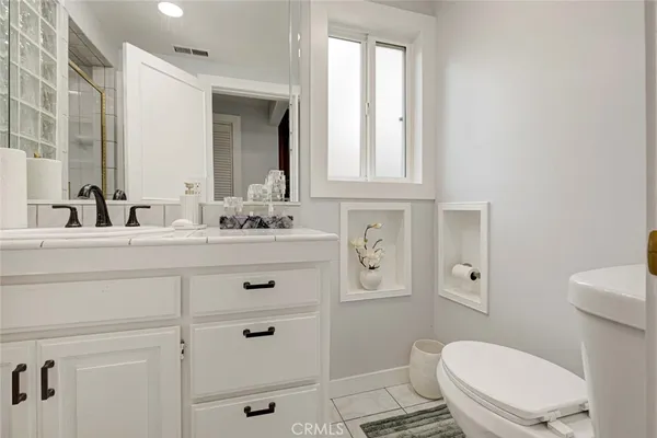 a bathroom with a shower and a sink