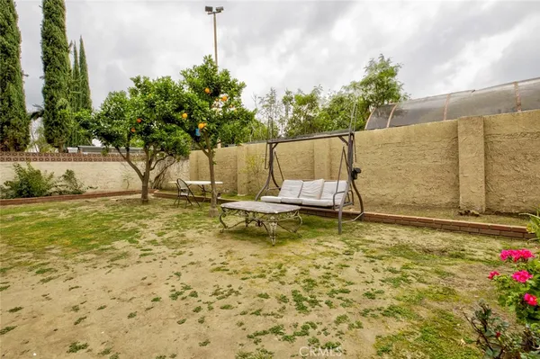 a view of a patio with chair and tables