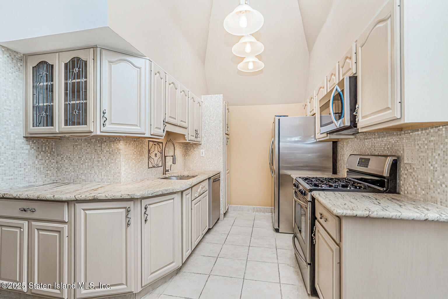 175 Winding Woods Loop, Unit 69 Staten Island, NY 10307 - Photo 11 of 29 a kitchen with stainless steel appliances granite countertop a sink stove and cabinets