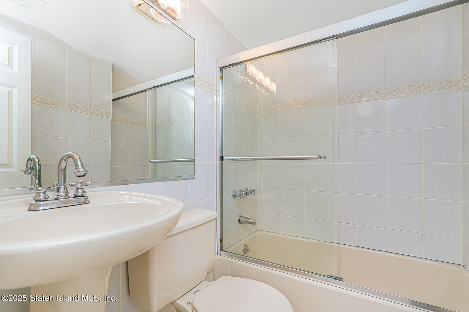 175 Winding Woods Loop, Unit 69 Staten Island, NY 10307 - Photo 16 of 29 a bathroom with a sink toilet and shower