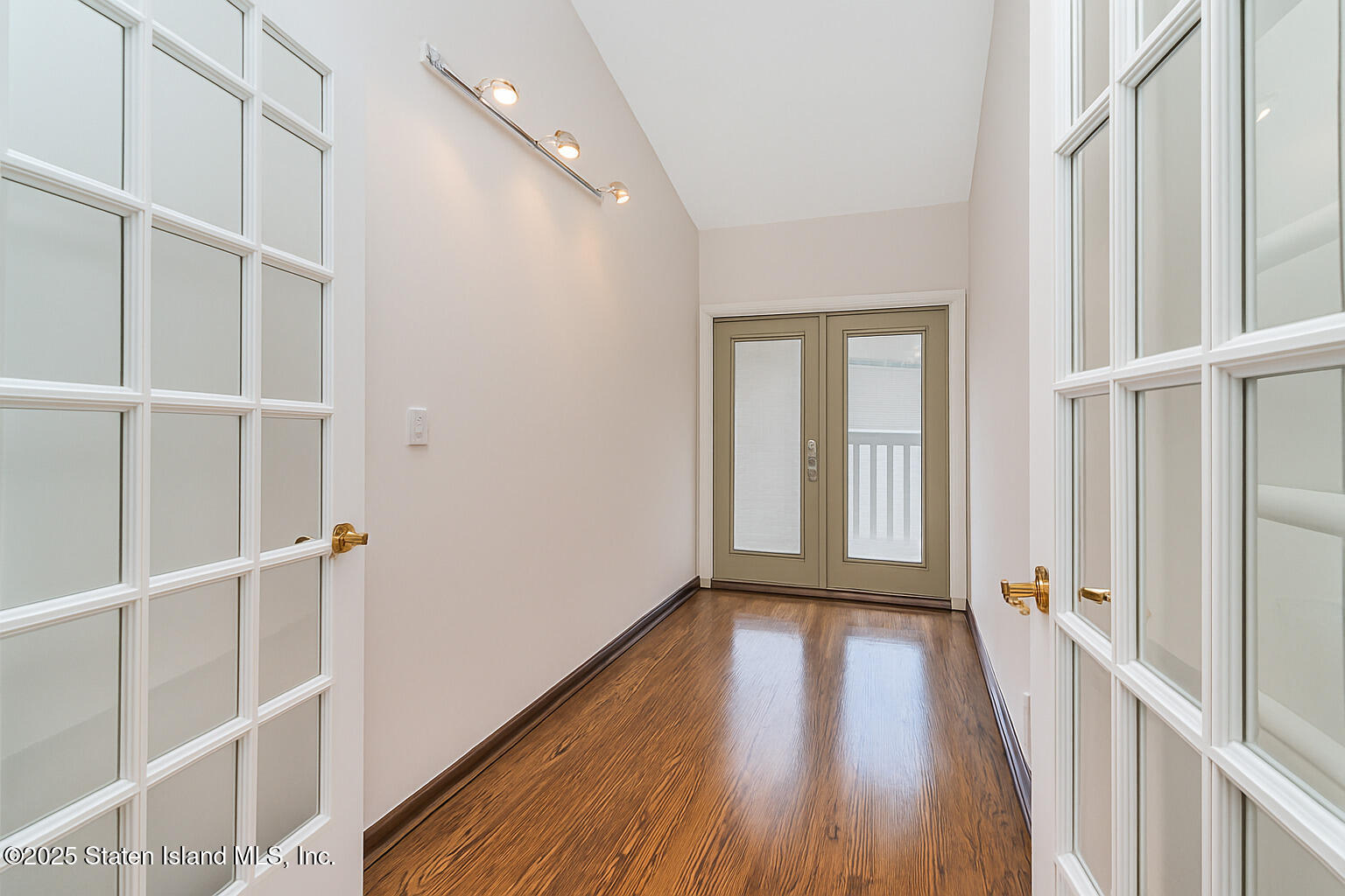 175 Winding Woods Loop, Unit 69 Staten Island, NY 10307 - Photo 20 of 29 a view of a hallway with wooden floor and entryway