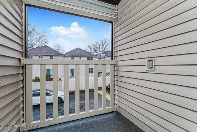 a view of a building with sitting area and furniture