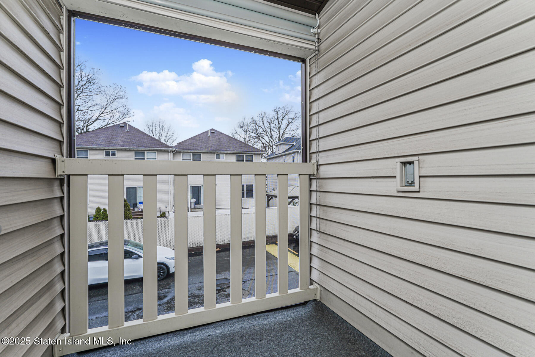 175 Winding Woods Loop, Unit 69 Staten Island, NY 10307 - Photo 22 of 29 a view of a house with a balcony