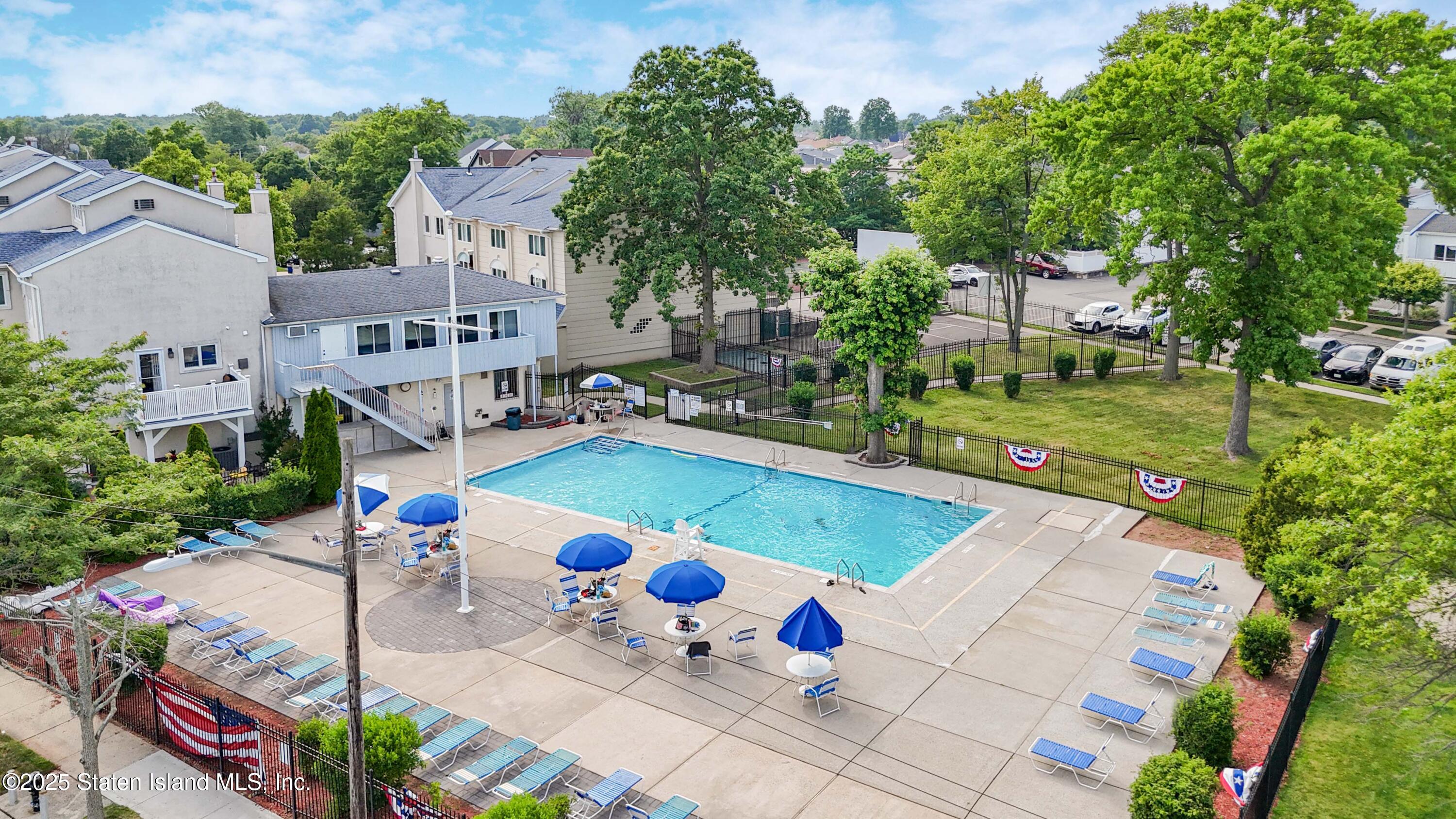 175 Winding Woods Loop, Unit 69 Staten Island, NY 10307 - Photo 24 of 29 an aerial view of a pool patio fire pit and outdoor seating