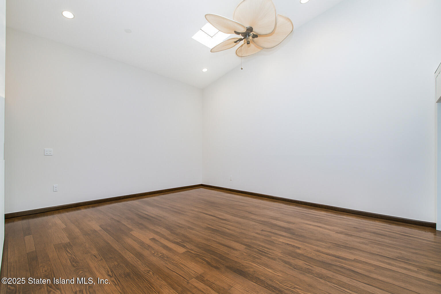 175 Winding Woods Loop, Unit 69 Staten Island, NY 10307 - Photo 10 of 29 a view of a room with wooden floor
