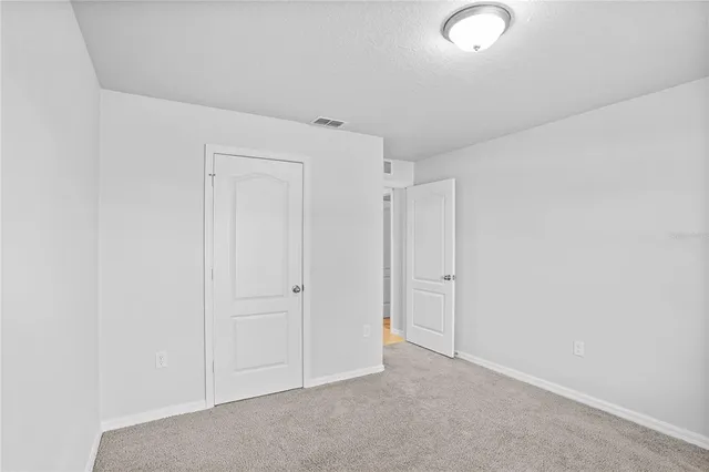 a view of open space with a big yard