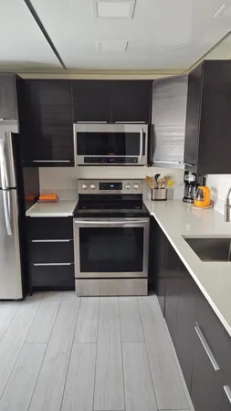 a kitchen with a stove and a microwave