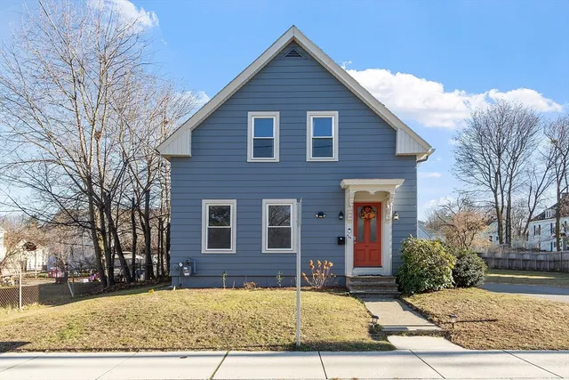 a view of a house with a yard